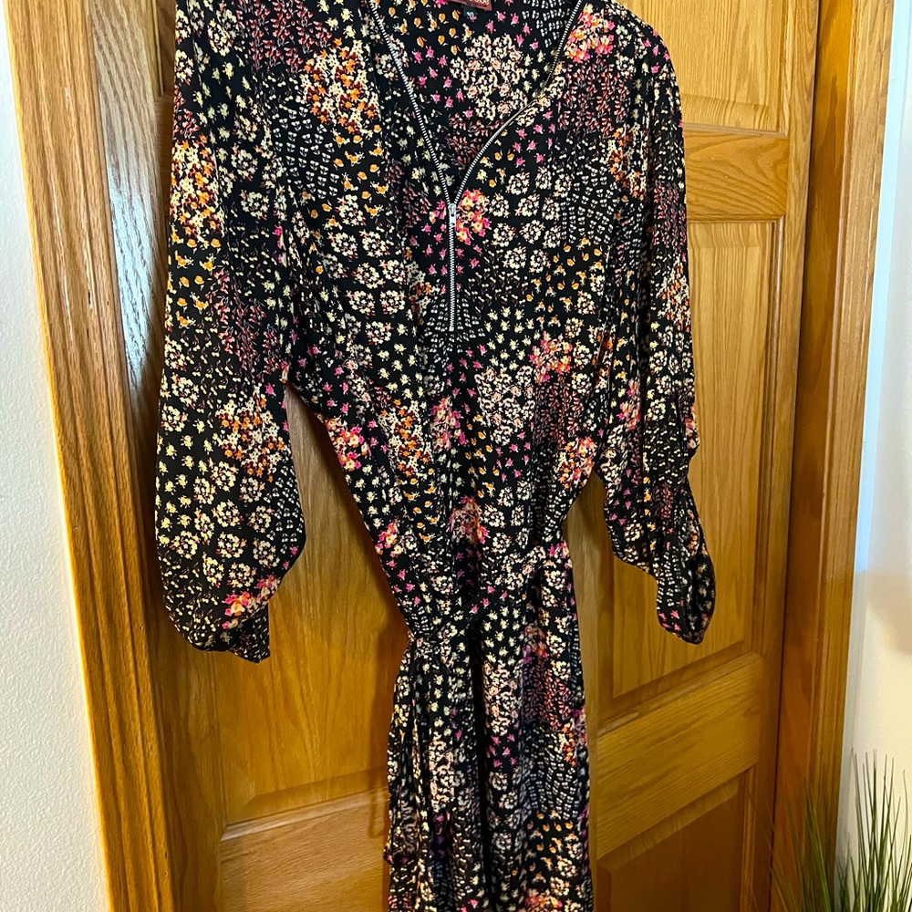 Floral black dress with zipper neckline and tie waist. 3/4 button sleeves